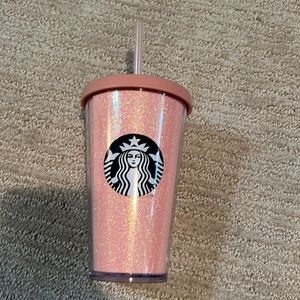 Pink iridescent starbucks cold cup.